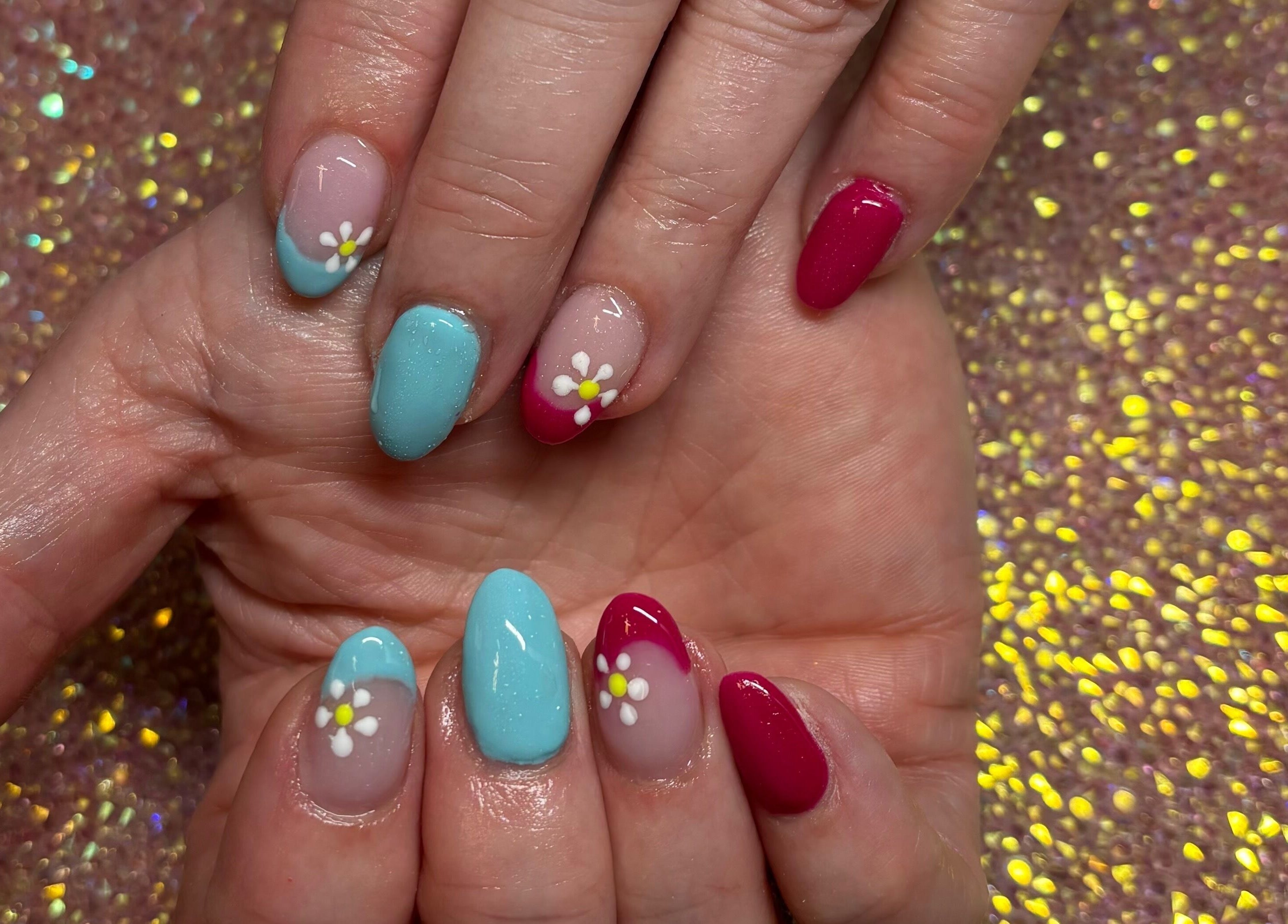 Beautiful floral nail art at Twinkle Toes and Fingers & Aesthetics, Taverham, England, GB. Perfectly detailed and colorful.