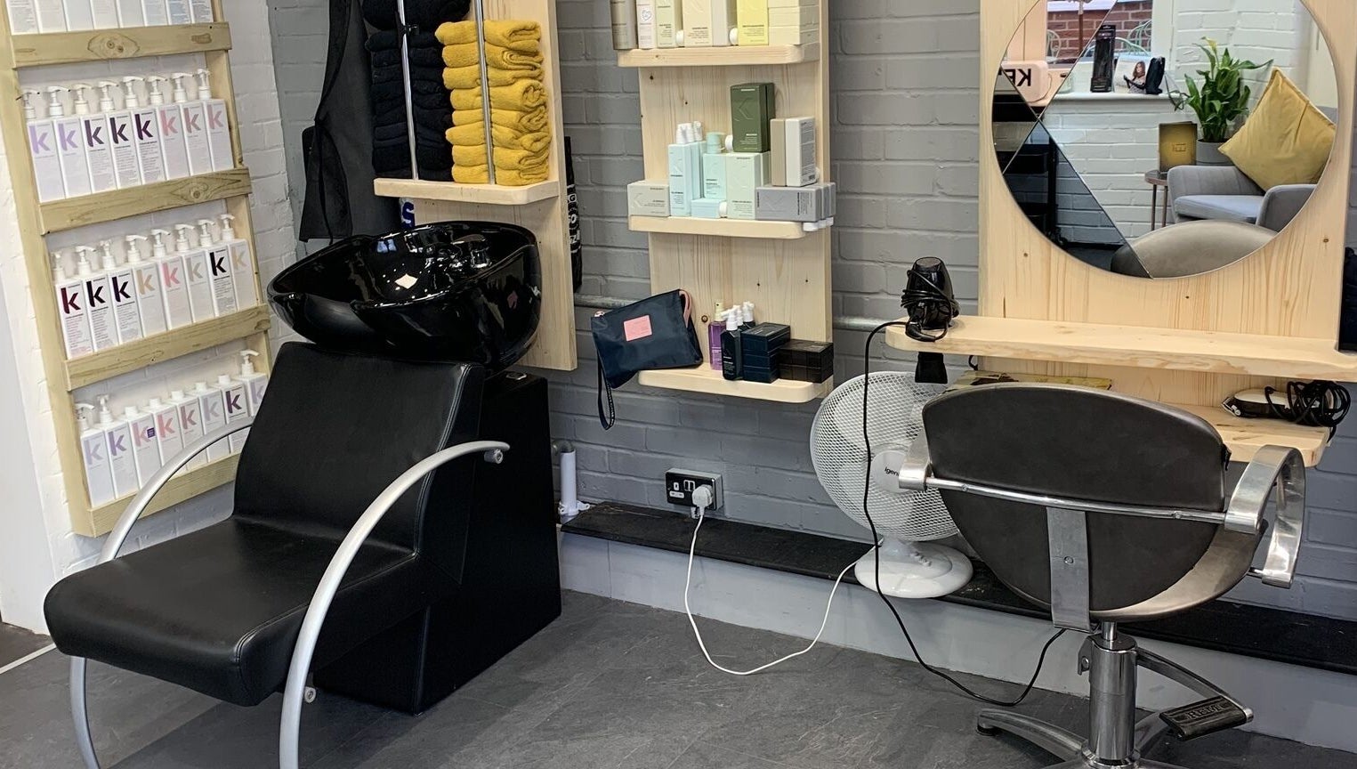 Modern hair styling station at Eistyling, Bedford, England, GB with sleek designs and premium products.