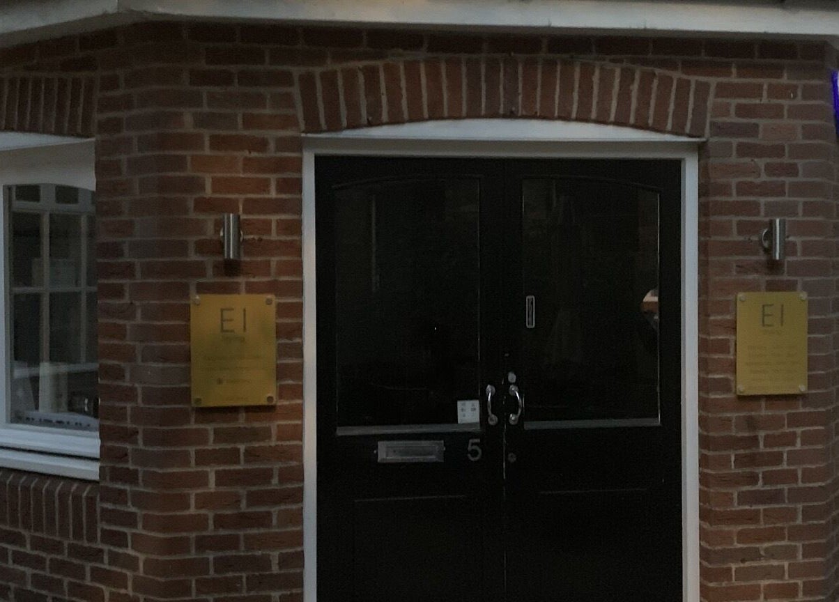 Entrance of Eistyling beauty venue, showcasing brick facade and signage in Bedford, England, GB.