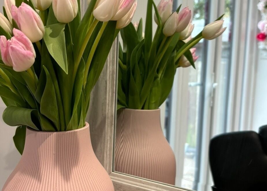 Elegant tulip vase at Lenice Kennedy Hair, Burton Latimer, England, GB, stylish salon decor.