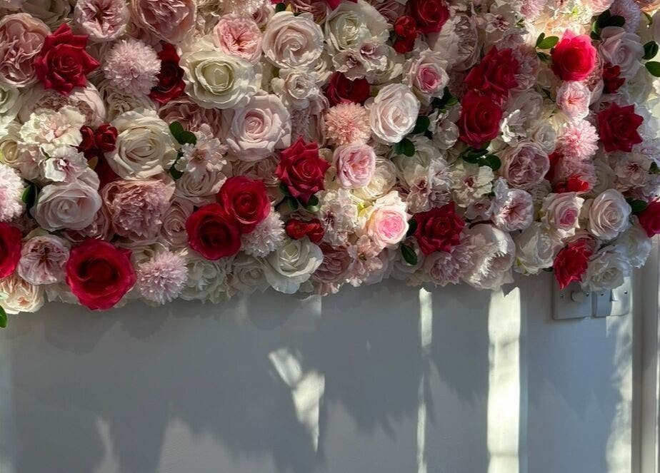 A vibrant floral wall decor at Lenice Kennedy Hair in Burton Latimer, England, GB.
