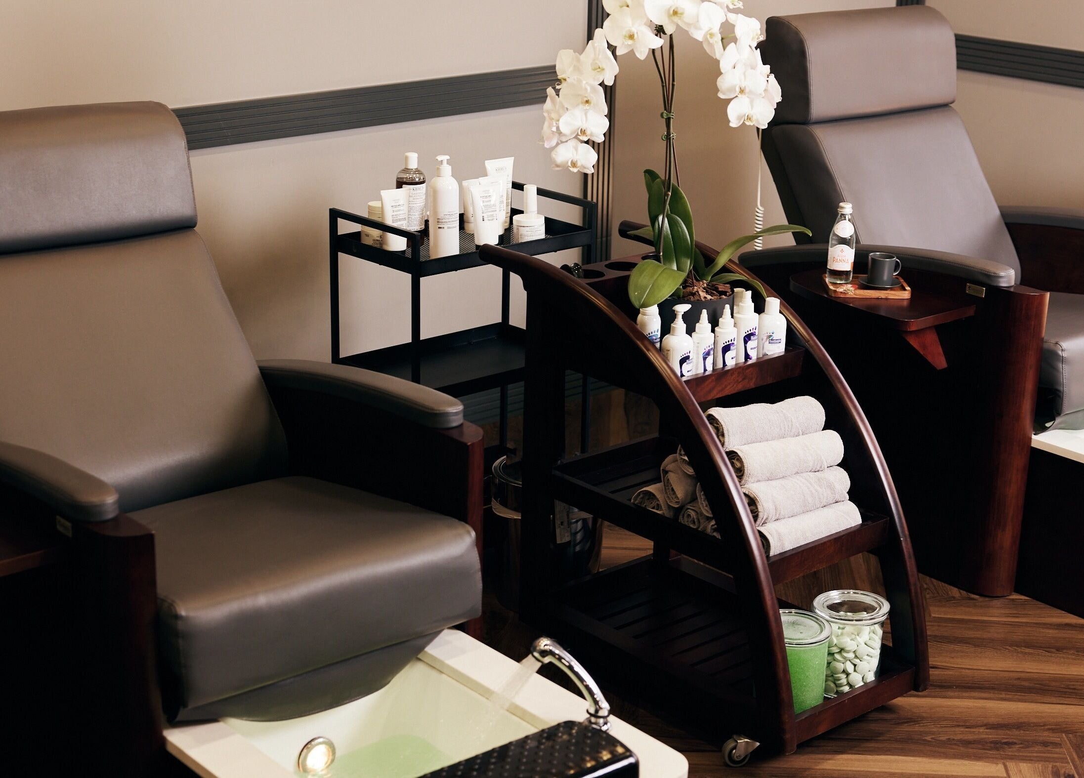 Luxurious spa chairs and products at CG Barbershop, Dubai, AE, offering a relaxing wellness experience.