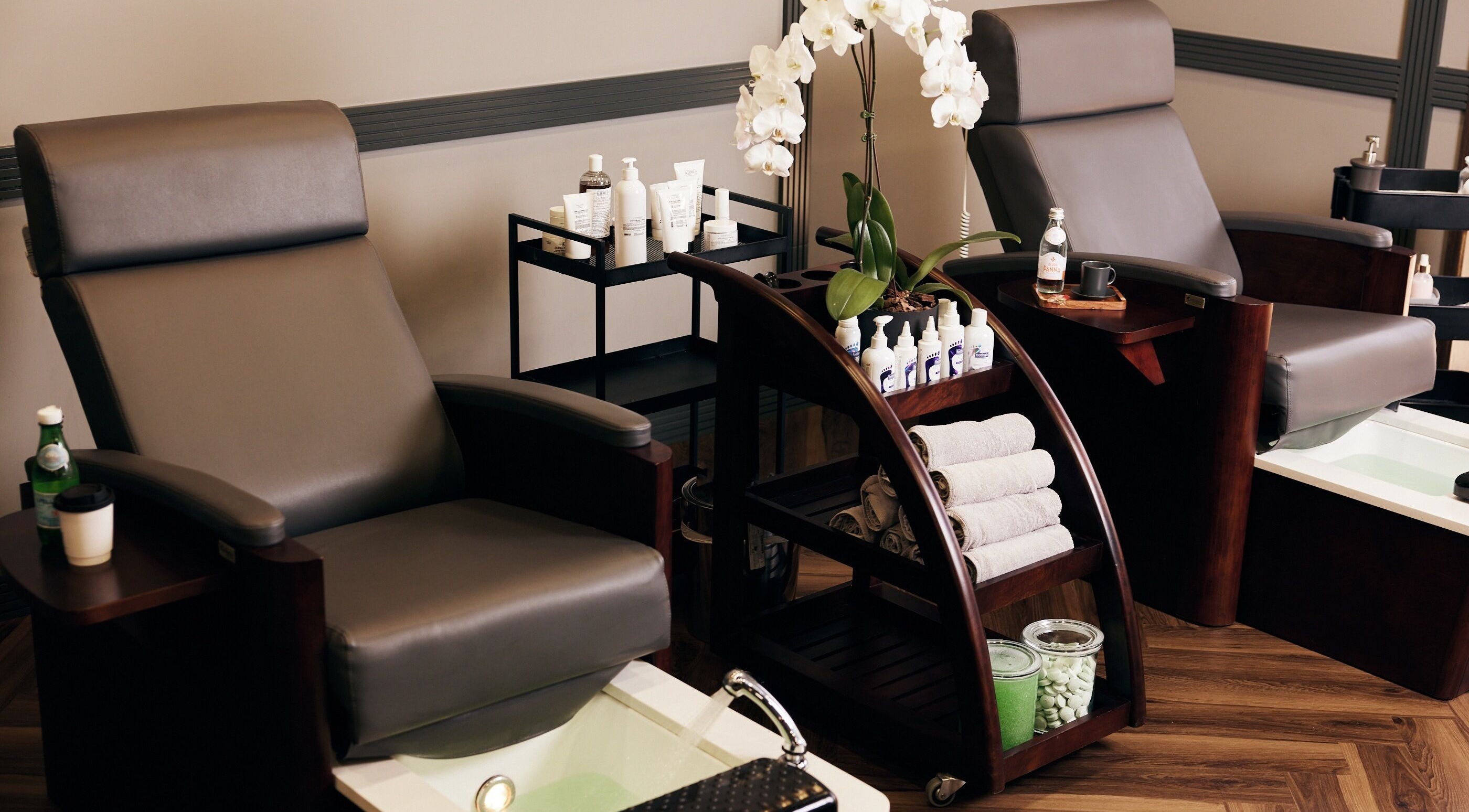 Luxurious spa chairs and products at CG Barbershop, Dubai, AE, offering a relaxing wellness experience.