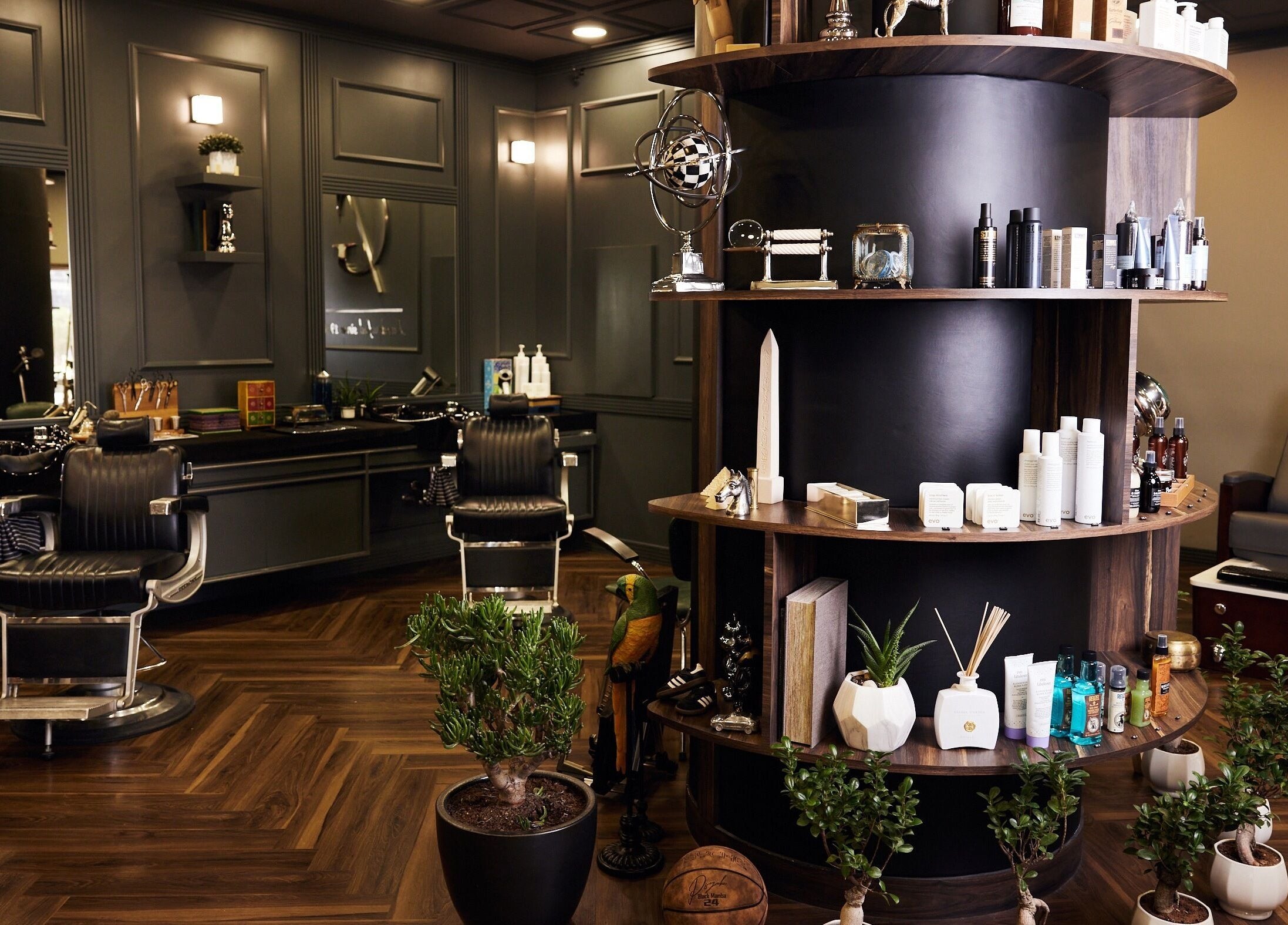 Luxurious interior of CG Barbershop in Dubai, AE showcasing plush barber chairs and premium grooming products.