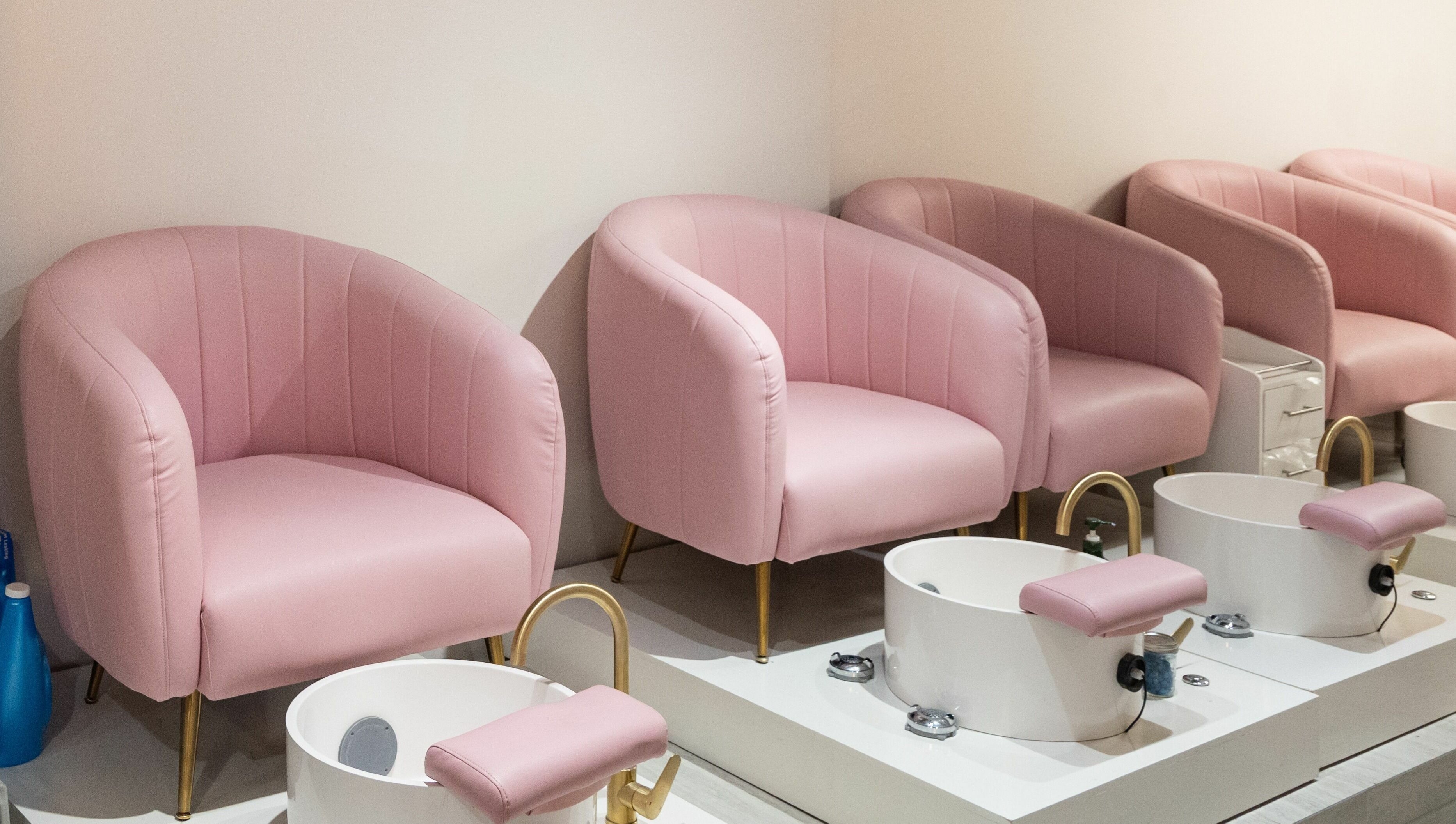 Elegant pink pedicure chairs at BeeQ Downtown A2, Ann Arbor, Michigan, US, offering comfort and style.