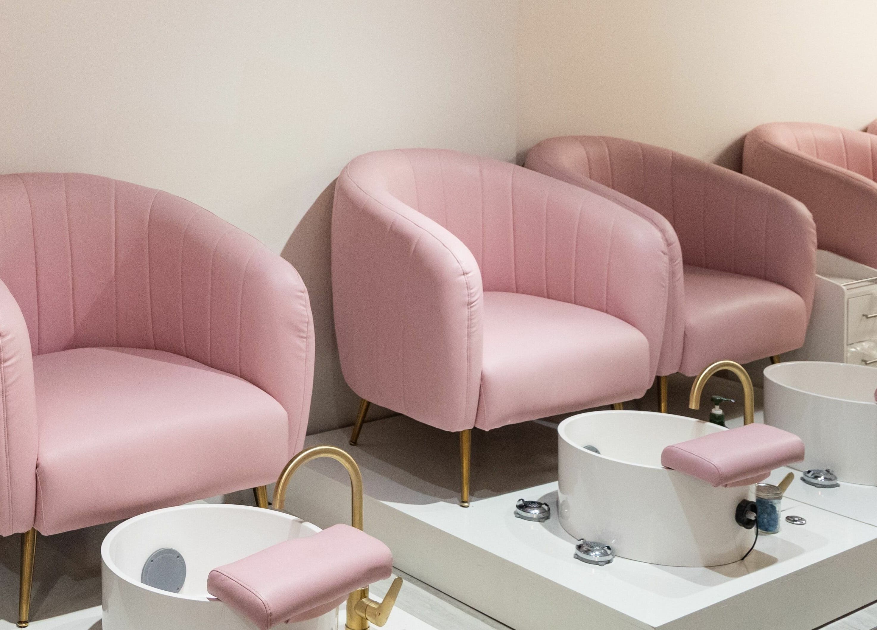 Elegant pink pedicure chairs at BeeQ Downtown A2, Ann Arbor, Michigan, US, offering comfort and style.
