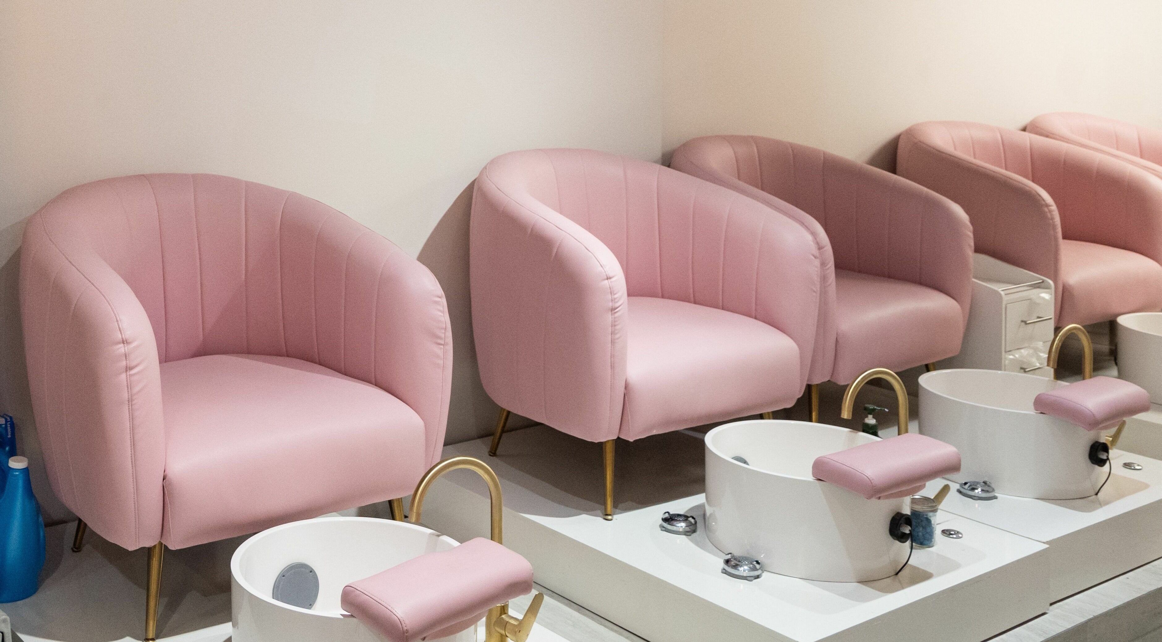 Elegant pink pedicure chairs at BeeQ Downtown A2, Ann Arbor, Michigan, US, offering comfort and style.
