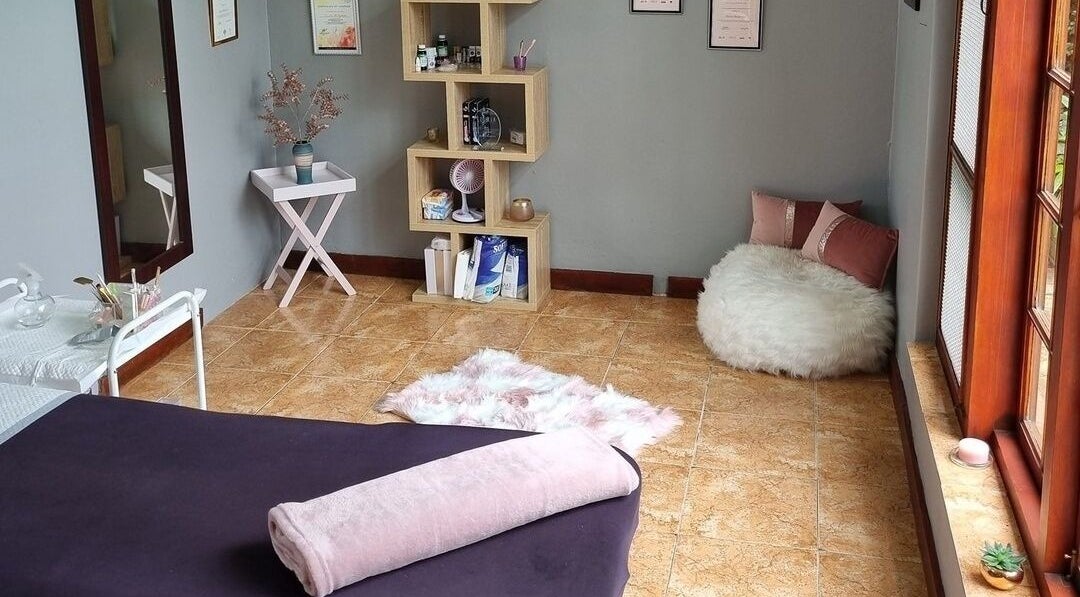 Relaxing room at The Brow Room, Port Elizabeth, Eastern Cape, ZA featuring cozy seating and neutral decor.