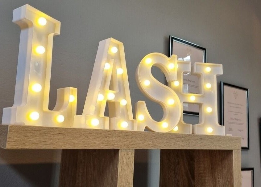 Illuminated 'LASH' sign at The Brow Room, Port Elizabeth, Eastern Cape, ZA highlighting lash services.