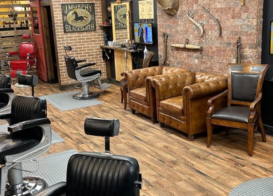 Interior of Kings and Little Ones Barber Shop in Cornwall, Ontario, CA with vintage chairs and rustic decor.