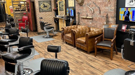 Interior of Kings and Little Ones Barber Shop in Cornwall, Ontario, CA with vintage chairs and rustic decor.
