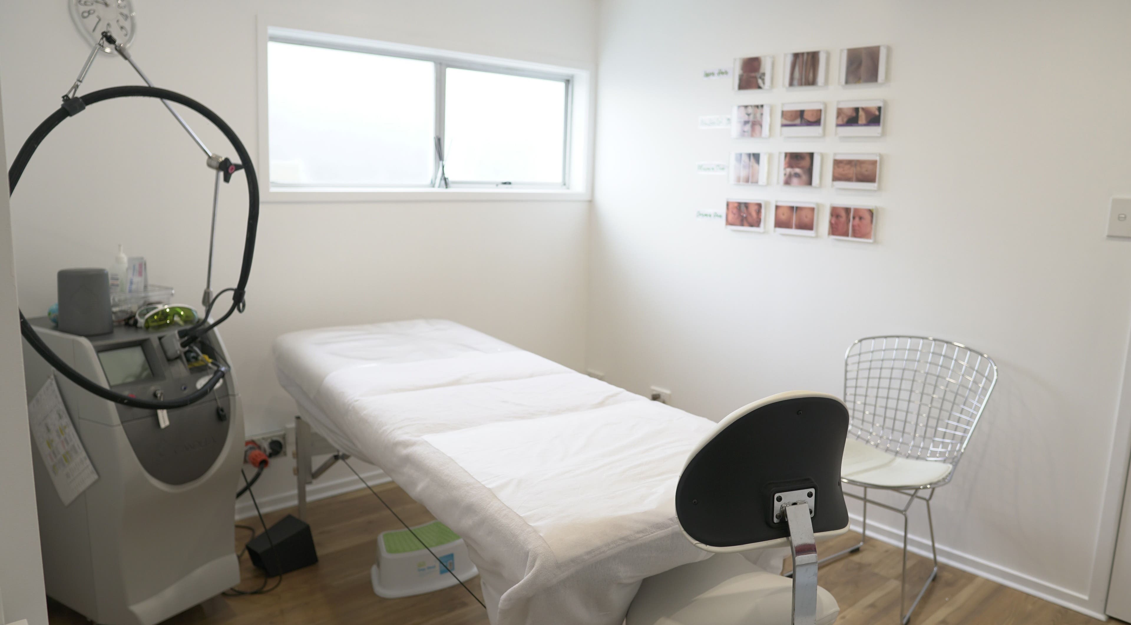 Calm and modern treatment room at Beautilase, Auckland, Auckland, NZ, featuring a treatment bed and equipment.