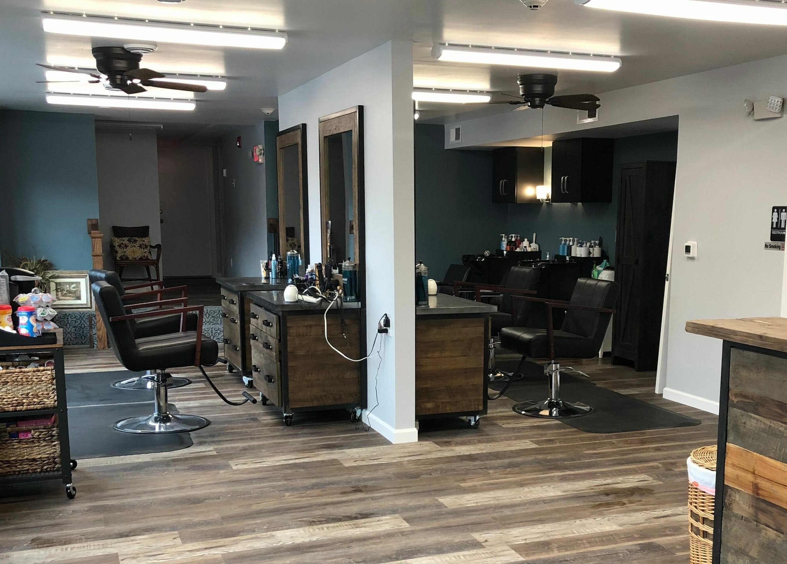 Modern interior of Shear Integrity salon in McMurray, Pennsylvania, US showcasing sleek design and wooden decor.