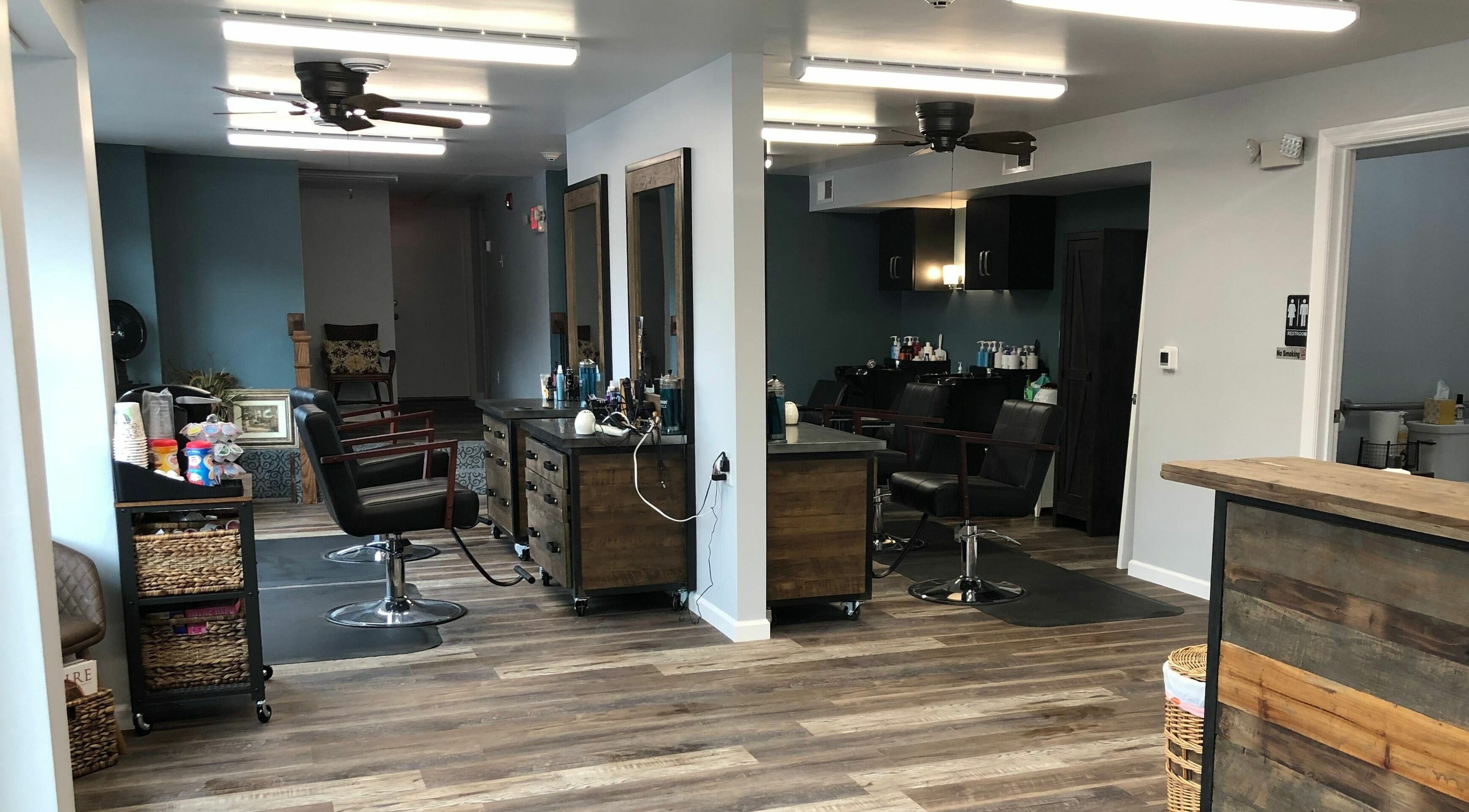 Modern interior of Shear Integrity salon in McMurray, Pennsylvania, US showcasing sleek design and wooden decor.