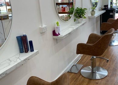 Stylish brown chairs with marble shelves at Hair Therapy by Chloe, Mandurah, Western Australia, AU.