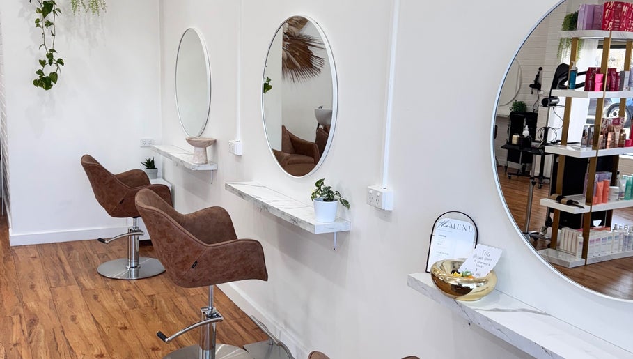 Elegant salon chairs and mirrors at Hair Therapy by Chloe, Mandurah, Western Australia, AU, promoting style.