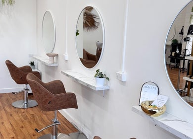 Elegant salon chairs and mirrors at Hair Therapy by Chloe, Mandurah, Western Australia, AU, promoting style.
