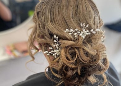 Intricate bridal updo with pearl accessories at Hair Therapy by Chloe, Mandurah, Western Australia, AU.