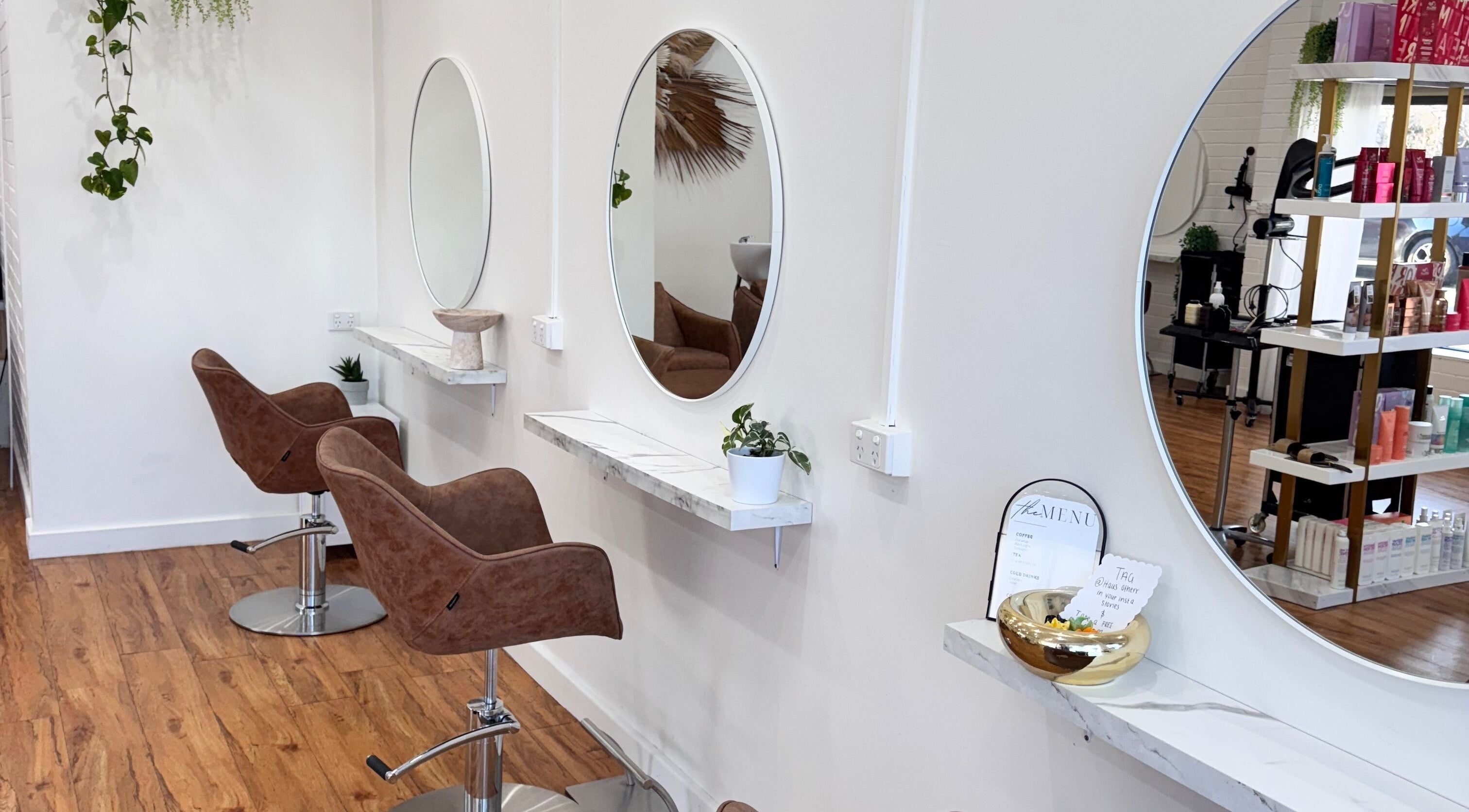 Inside Hair Therapy by Chloe, Mandurah, Western Australia, AU, featuring chic styling chairs and mirrors.