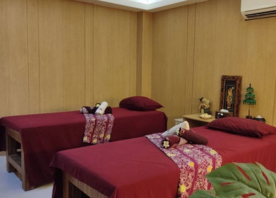 Relaxing massage room at Shang Nyai Salon & Spa, Daerah Khusus Ibukota Jakarta, ID with adorned treatment beds.