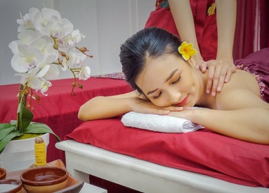 Relaxing massage at Shang Nyai Salon & Spa, Daerah Khusus Ibukota Jakarta, Indonesia, with orchids in view.
