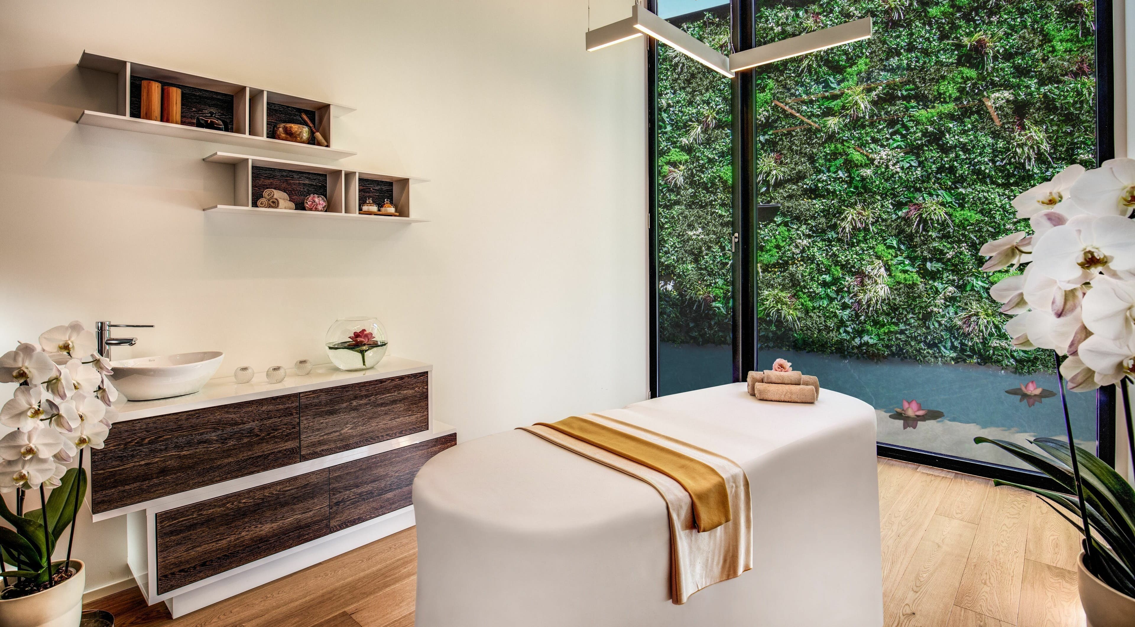 Tranquil spa room at Hotel Splendide Royal, Lugano, Ticino, CH with massage table and elegant decor.