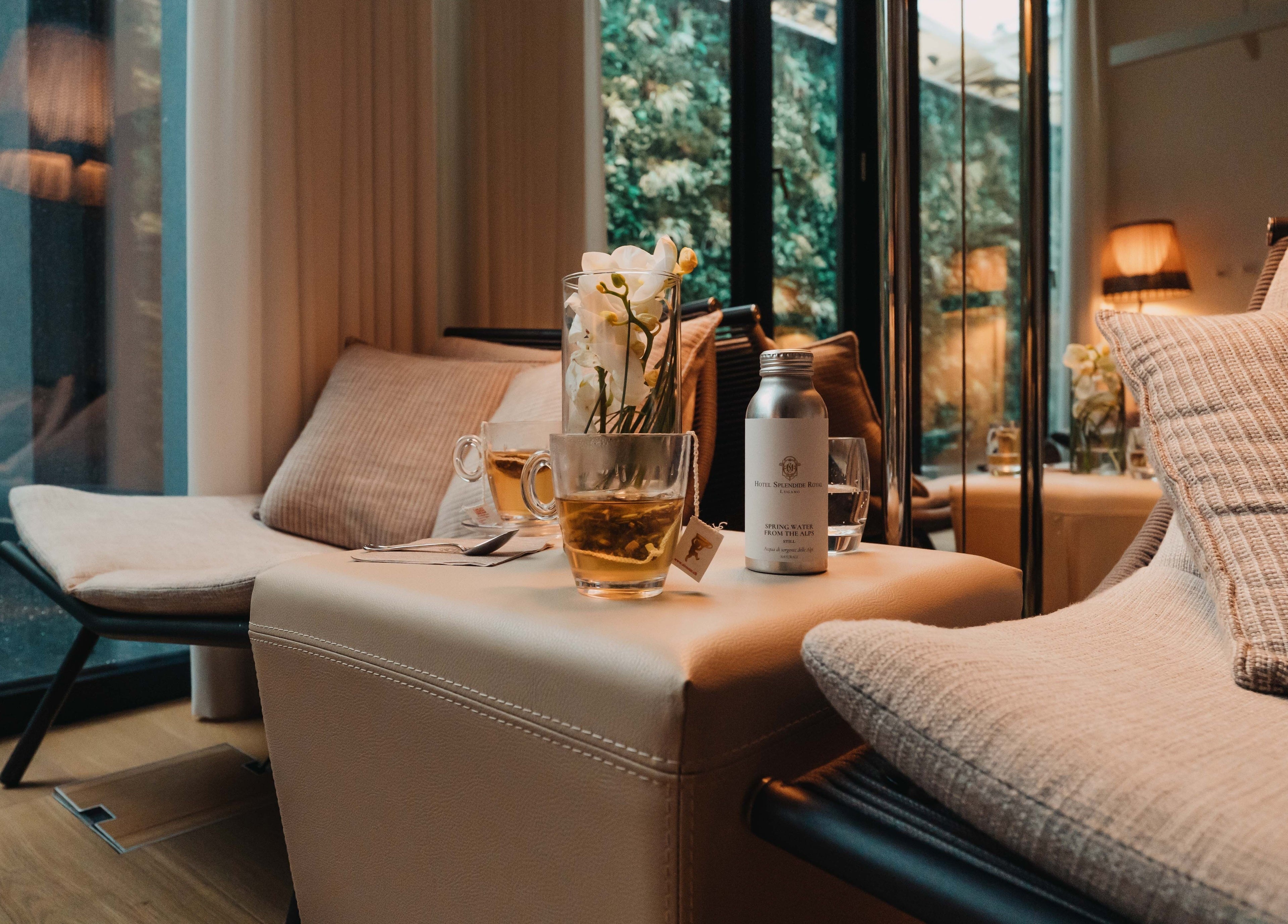 Cozy lounge area with tea at Hotel Splendide Royal, Lugano, Ticino, CH showcasing luxury and comfort.