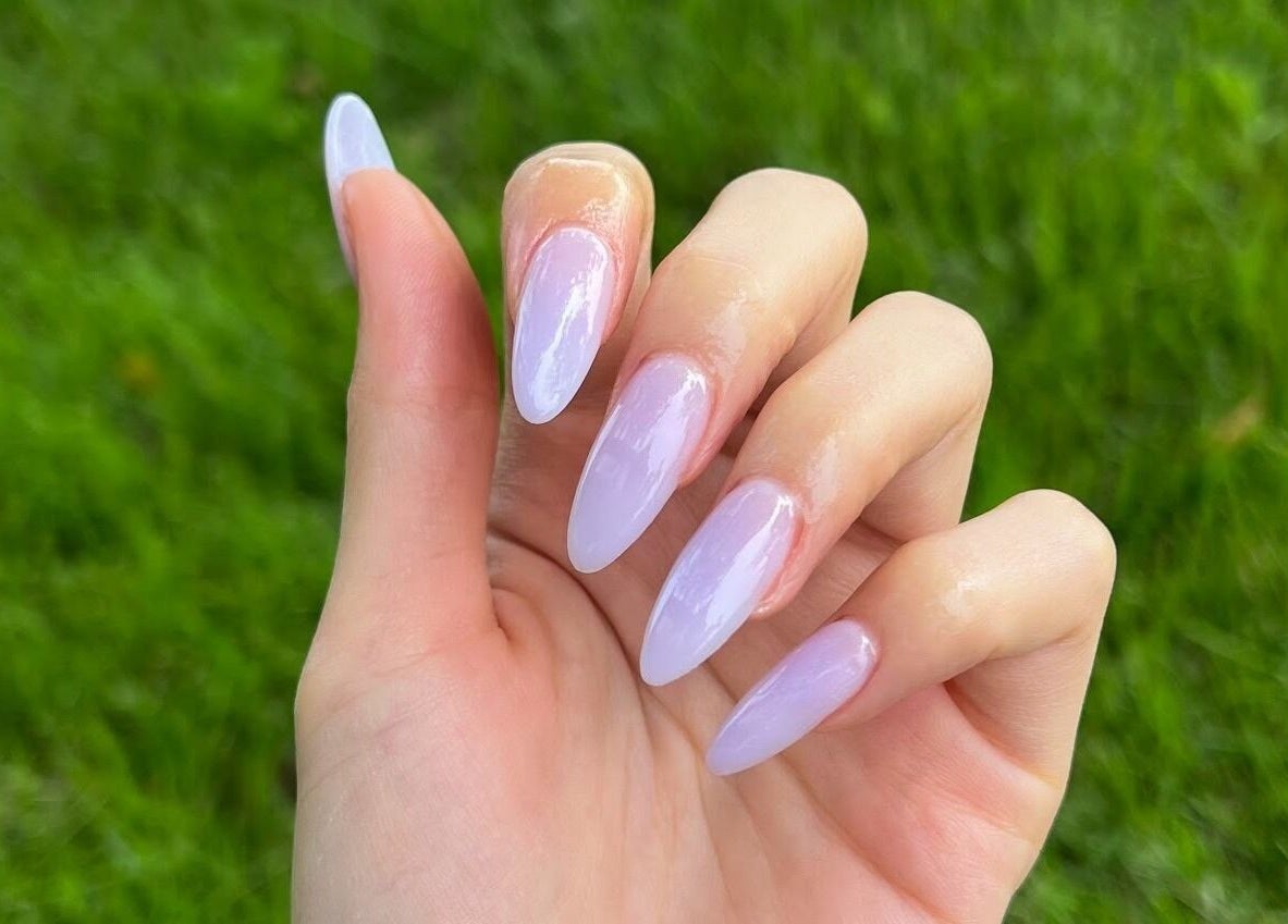 Lavender nails displayed at Dolly Lash Lounge, Pointe-Claire, Québec, CA highlighting manicure finesse.