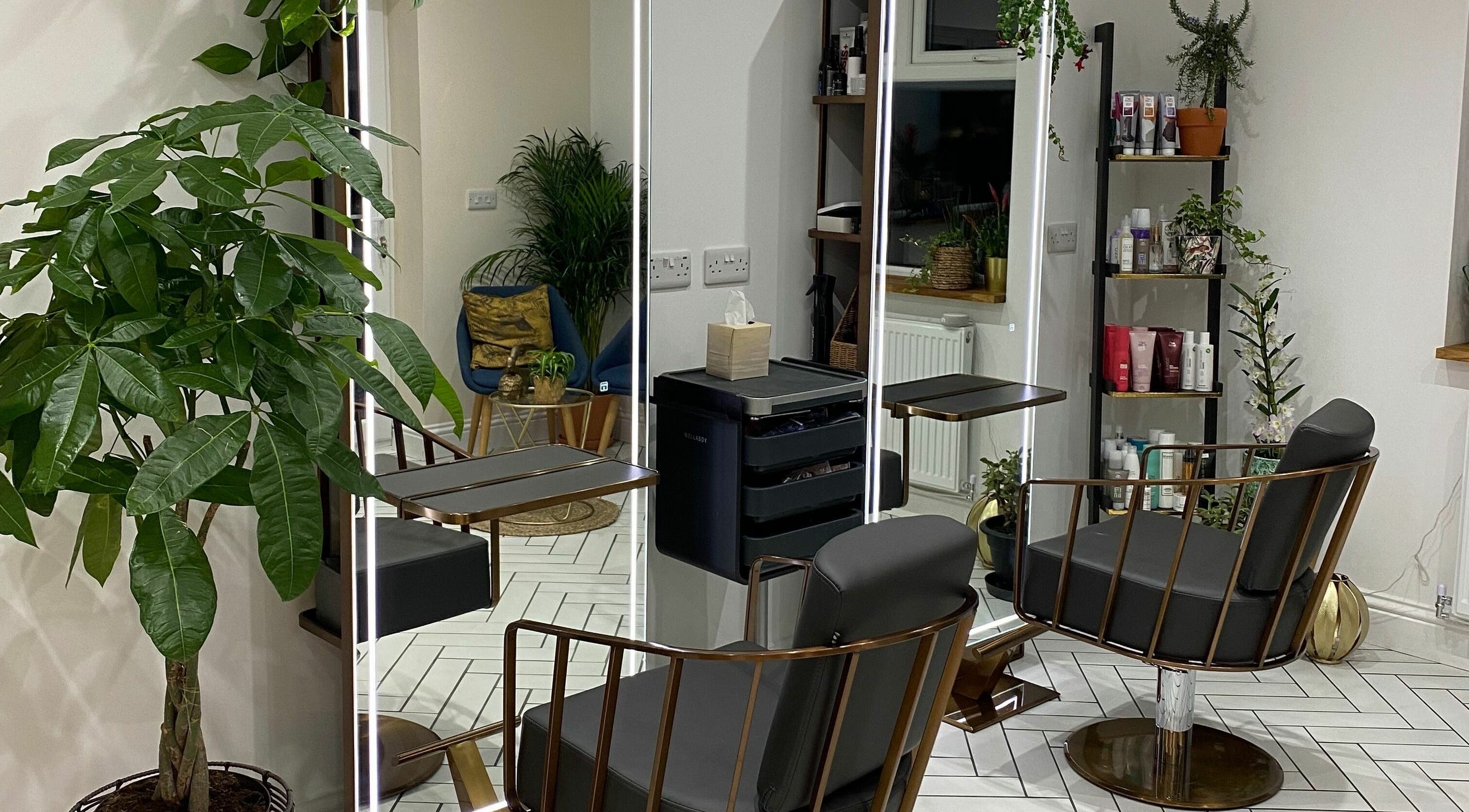 Elegant styling chairs and greenery at L W Hair, Arnold, England, GB for a refreshing salon visit.