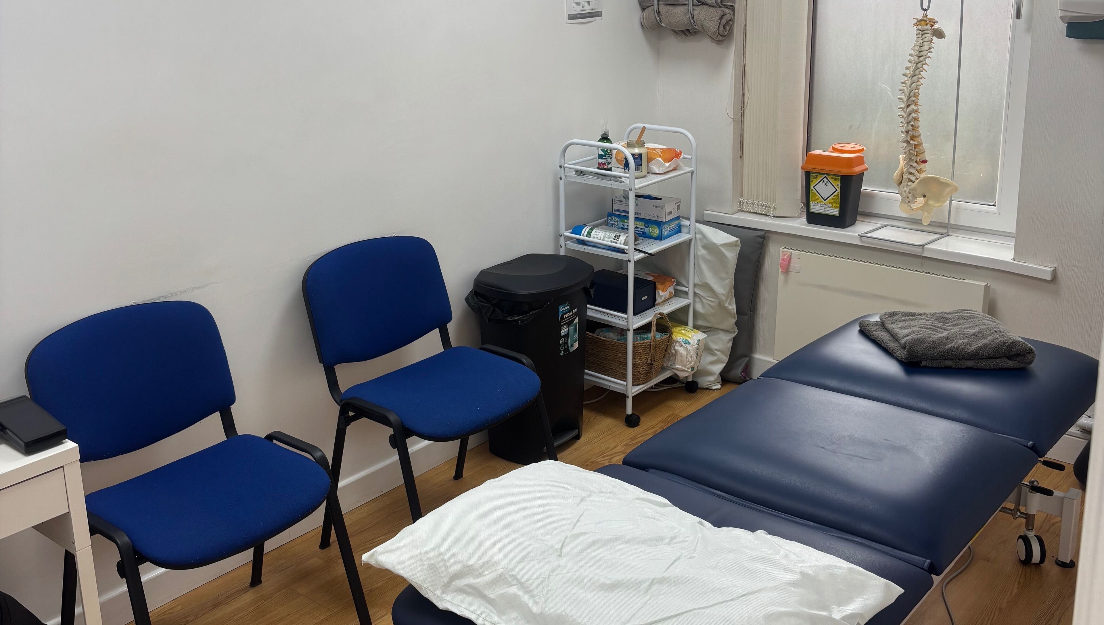 Therapy room at Align Therapies - Sketty Clinic in Sketty, Wales, GB with a massage table and chairs.