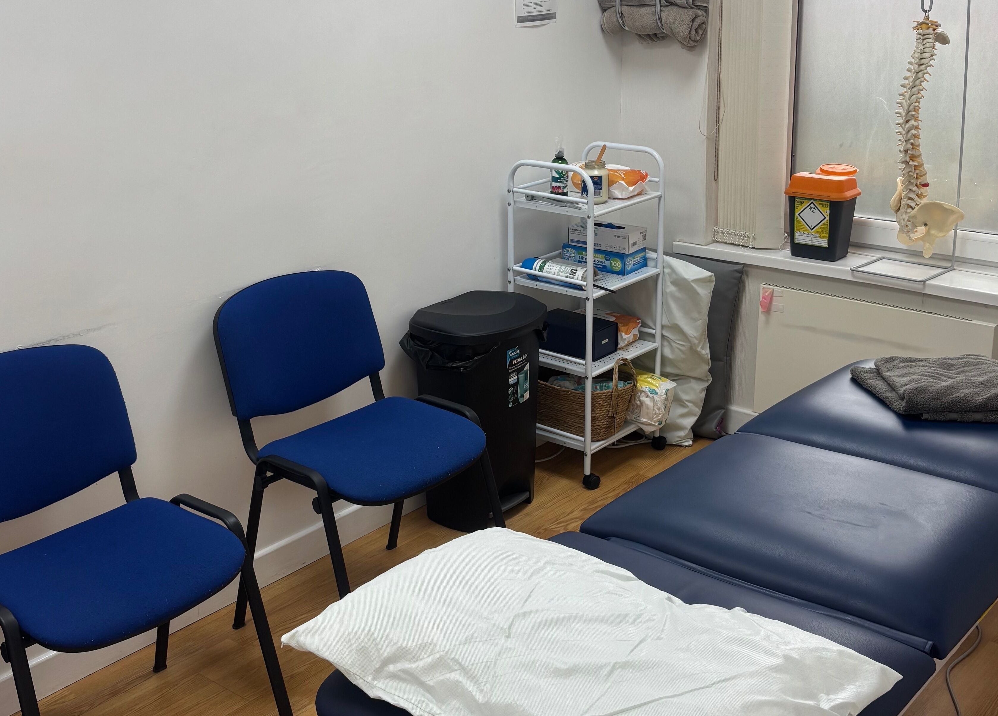 Therapy room at Align Therapies - Sketty Clinic in Sketty, Wales, GB with a massage table and chairs.