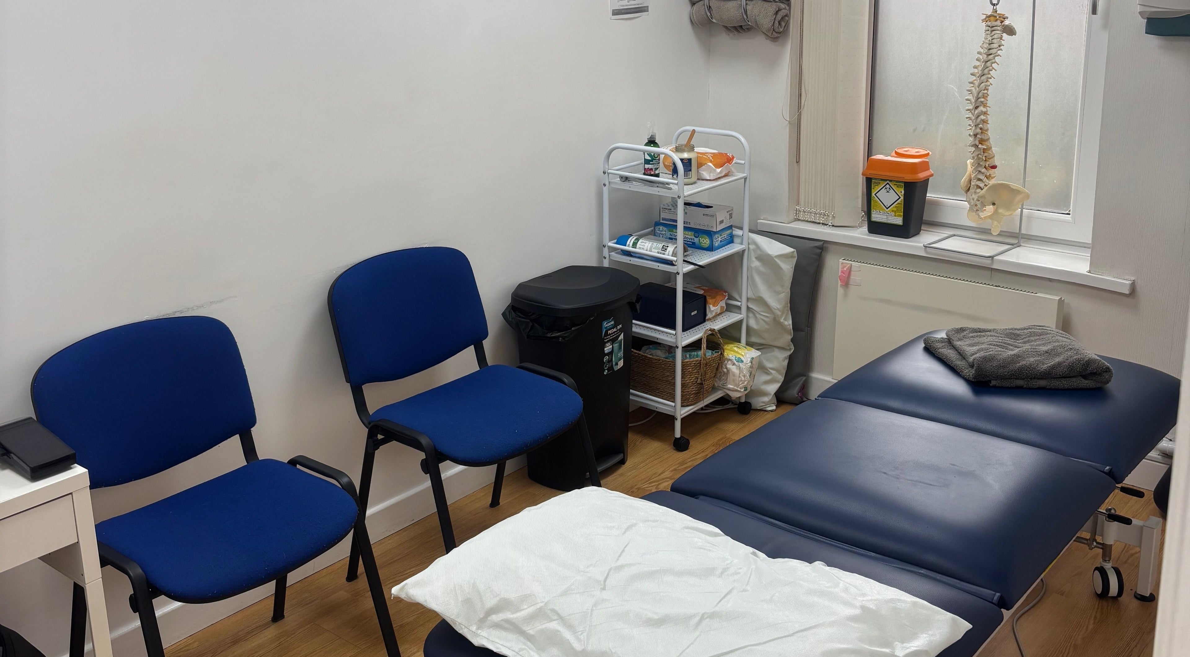 Therapy room at Align Therapies - Sketty Clinic in Sketty, Wales, GB with a massage table and chairs.