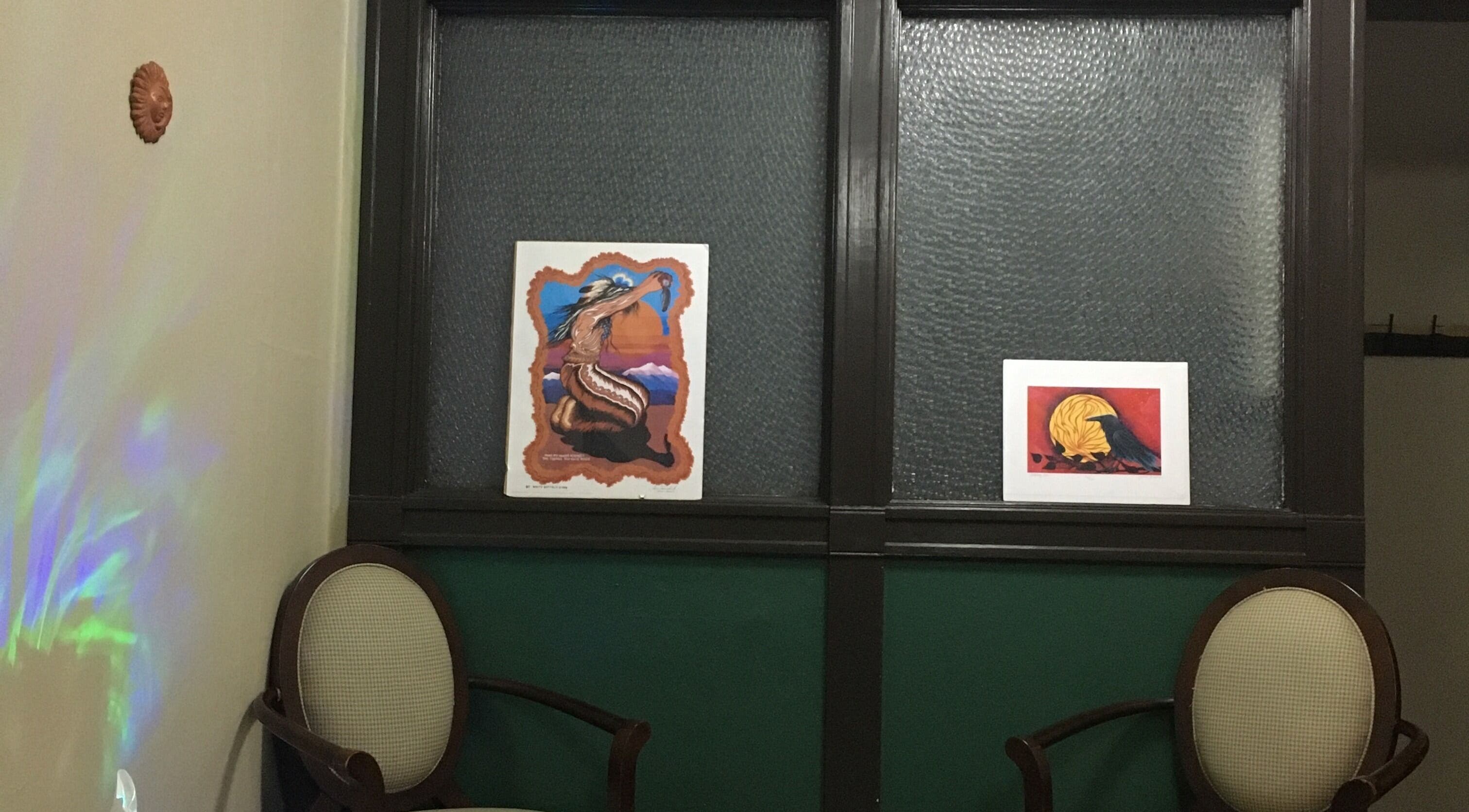 Cozy seating and art display at Free at Last, Thunder Bay, Ontario, CA, enhancing a tranquil ambiance.