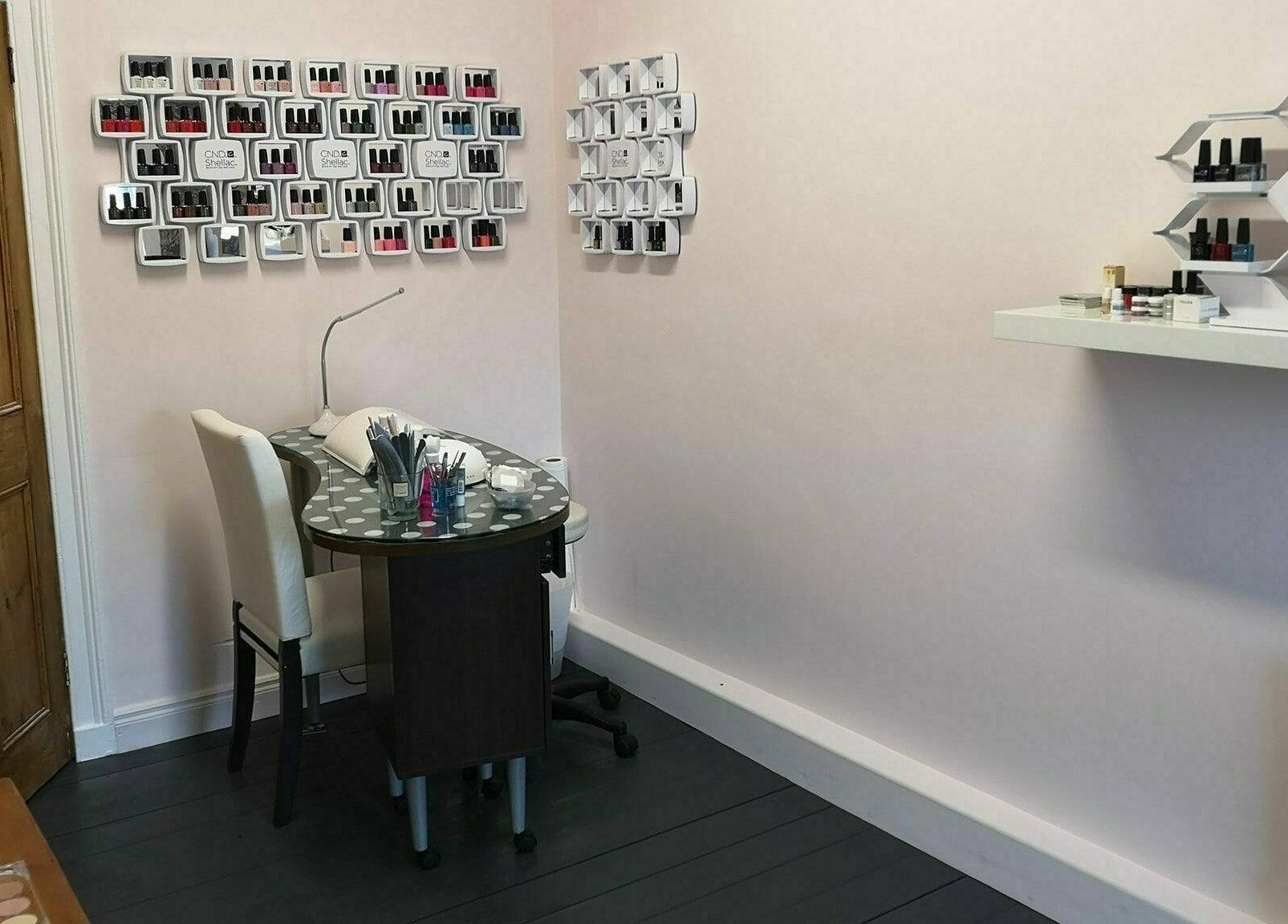 Cozy manicure station at Still Beauty, Rathdowney, County Laois, IE with nail polish displays.