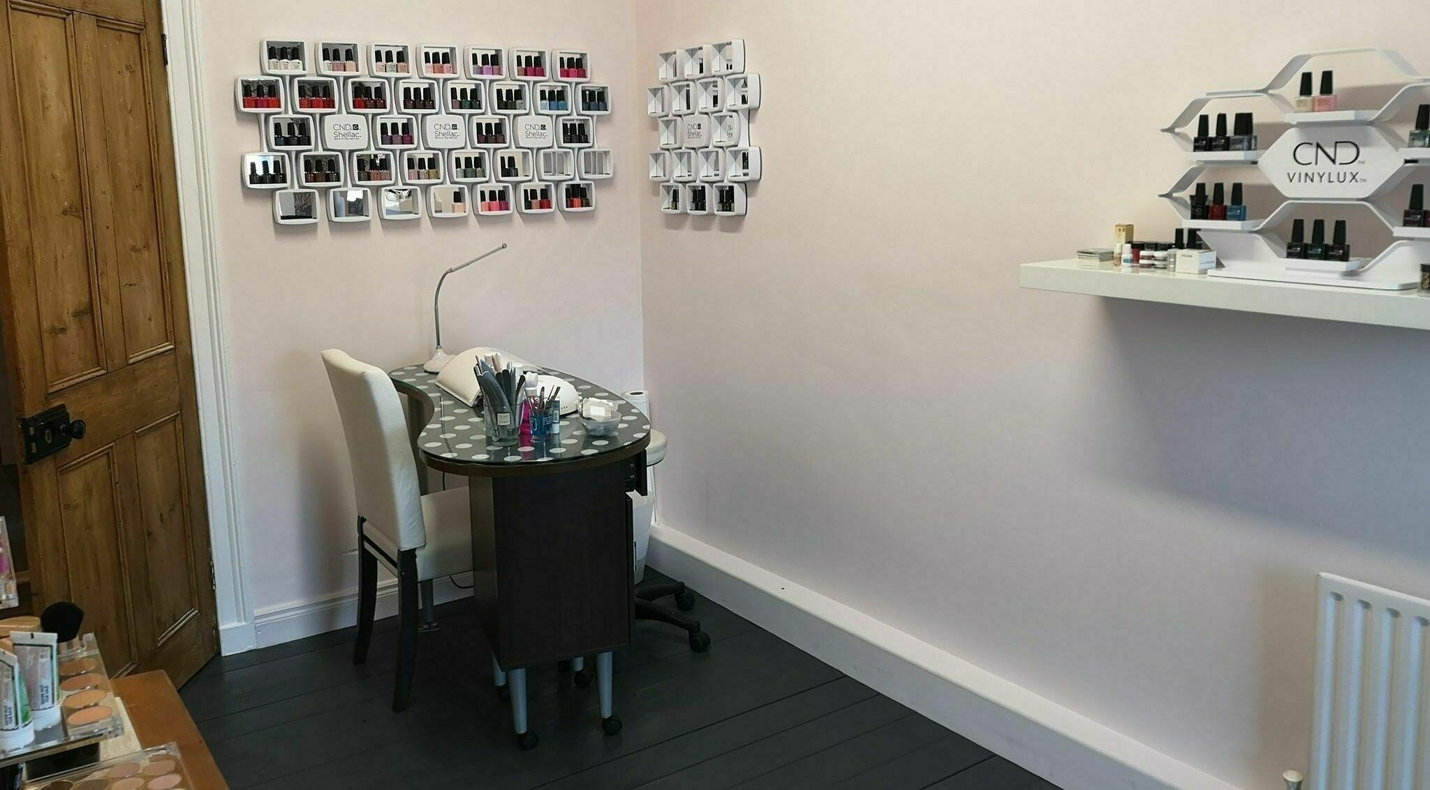 Cozy manicure station at Still Beauty, Rathdowney, County Laois, IE with nail polish displays.