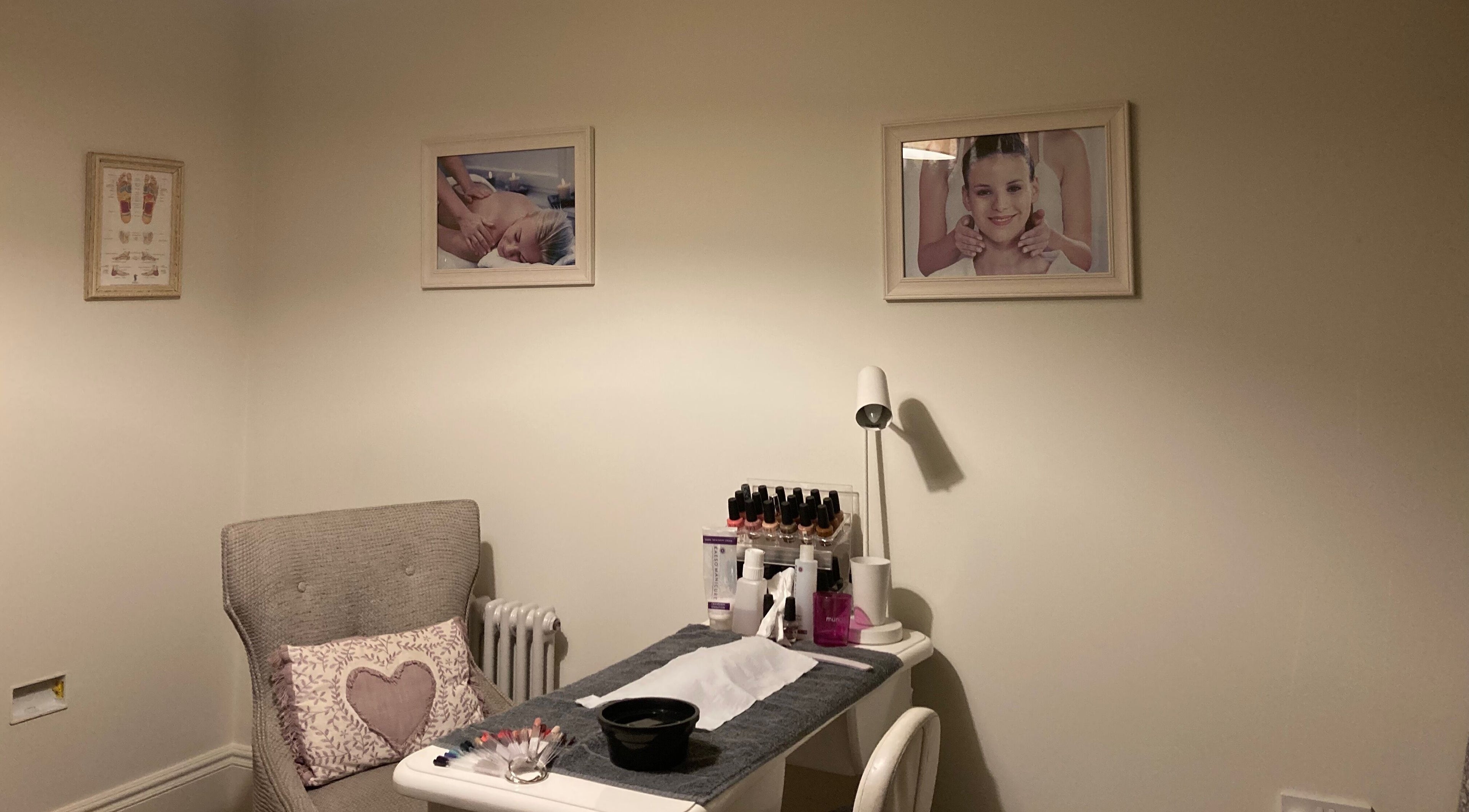 Relaxing spa room at Natural Beauty Thirsk, Cundall, England, GB with cozy chair and nail station.