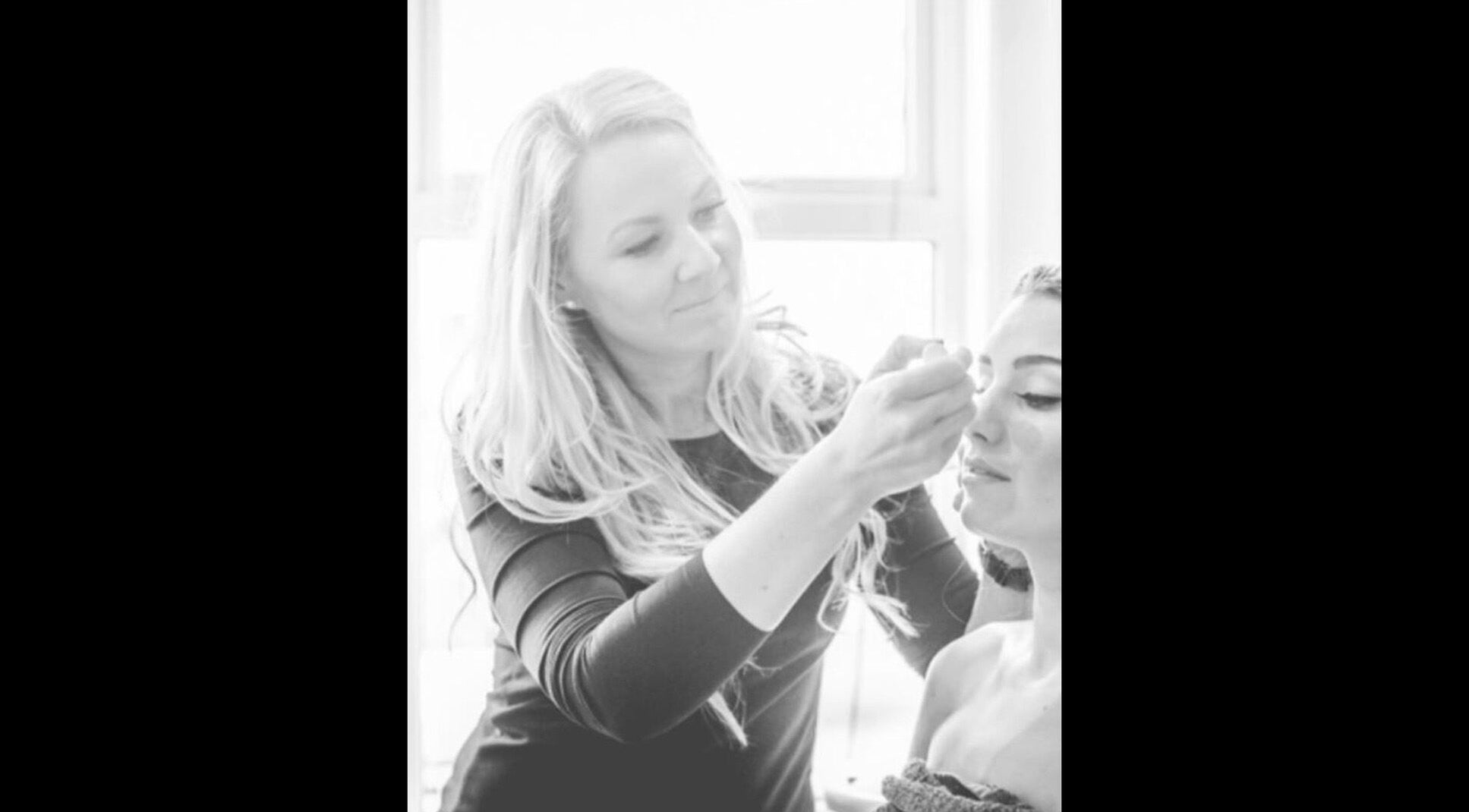 Beauty professional applying makeup at Alice K Beauty in Ballymena, Northern Ireland, GB.