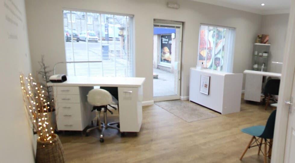 Inviting interior of Bella Salon in Nairn, Scotland, GB showcasing modern design with large windows and cozy seating.