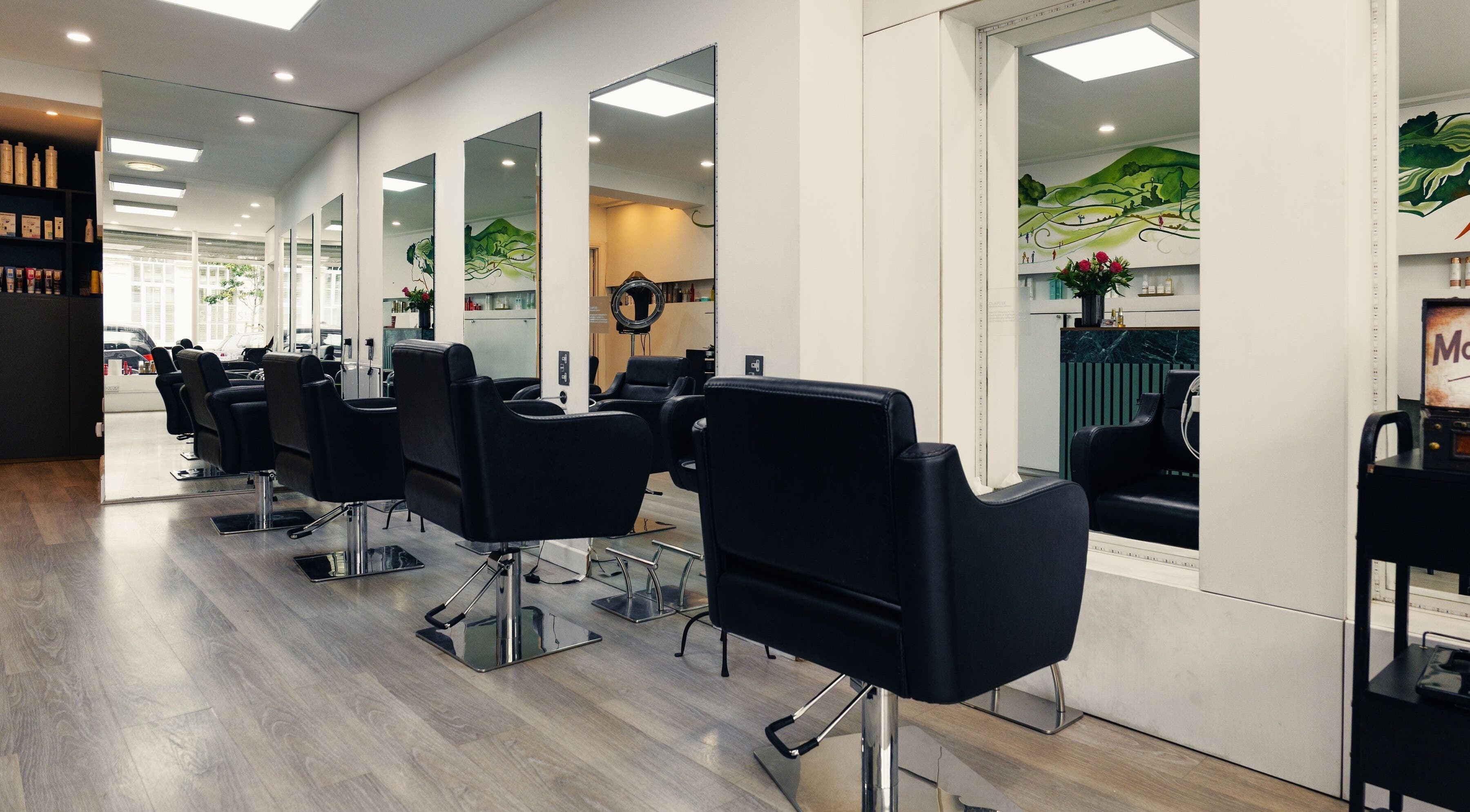 Sleek interior of Shades Primrose Hill, showcasing modern styling chairs in London, England, GB.