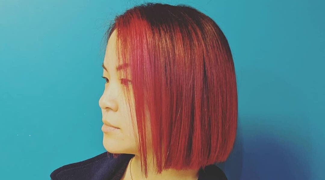 Side view of vibrant red bob hairstyle at Ritual Salon, Urbana, Illinois, US.