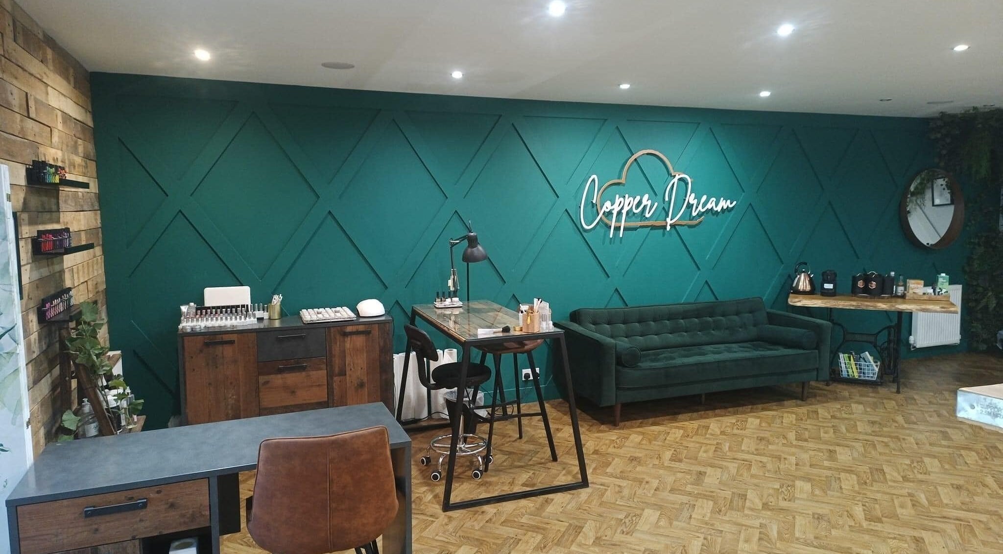 Modern interior of Copper Dream at Mitchelston Industrial Estate, Scotland, GB with teal walls and stylish decor.