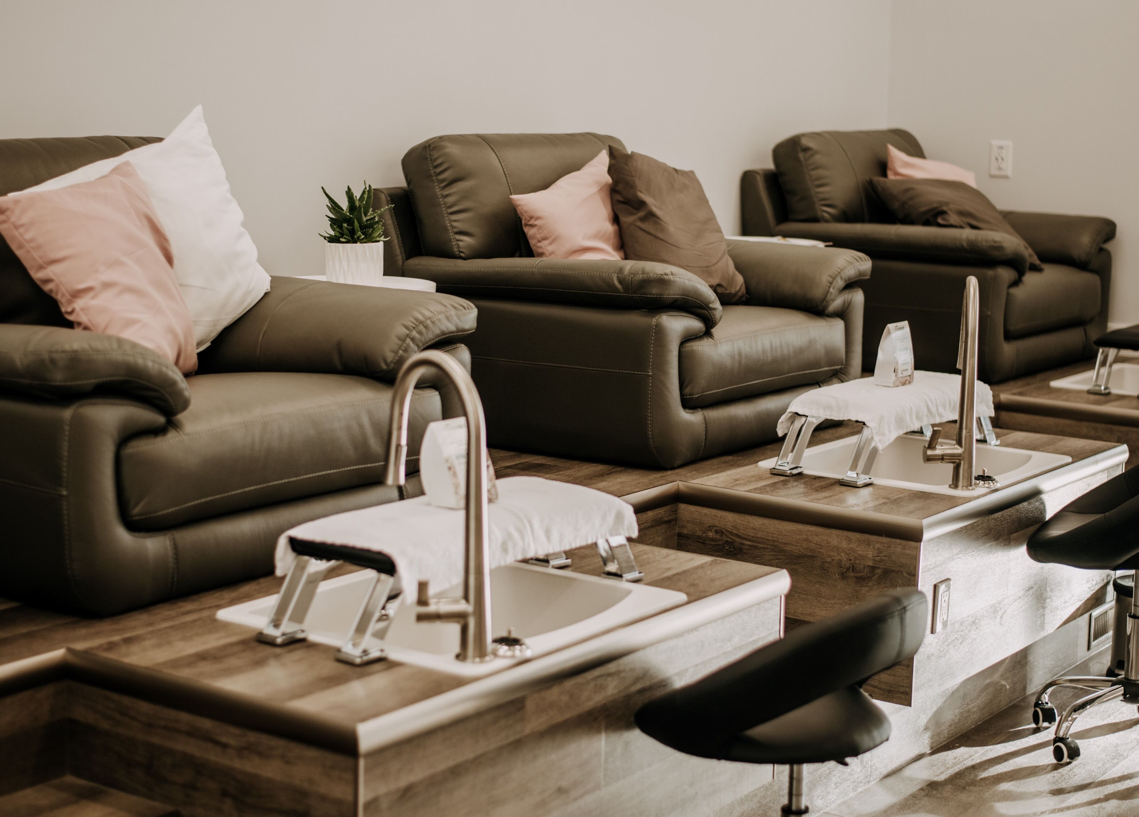 Comfortable leather chairs in pedicure area at 306 Day Spa, Watrous, Saskatchewan, CA offering relaxation.