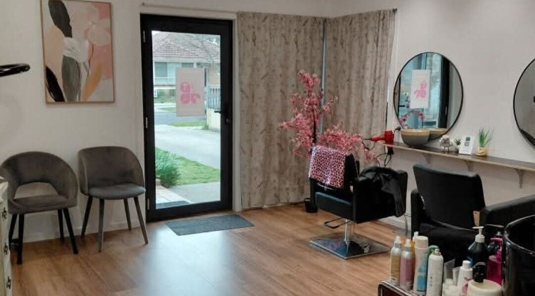Modern interior of Diamond Hair in Herne Hill, Victoria, AU, featuring stylish seating and mirrors.
