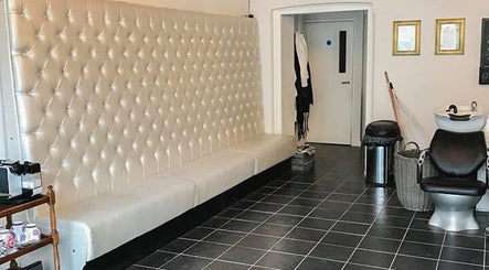 Elegant seating area at Charlotte's salon in Glossop, England, GB featuring plush decor.
