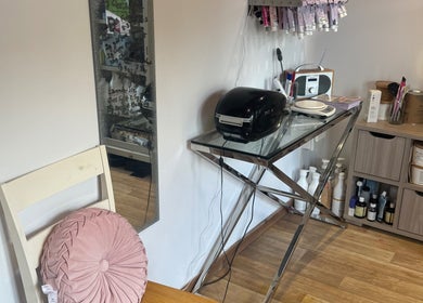 Stylish beauty setup at Charlotte's in Glossop, England, GB with a chic desk and beauty supplies.