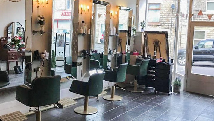 Chic salon interior with modern styling chairs at Charlotte's, Glossop, England, GB.