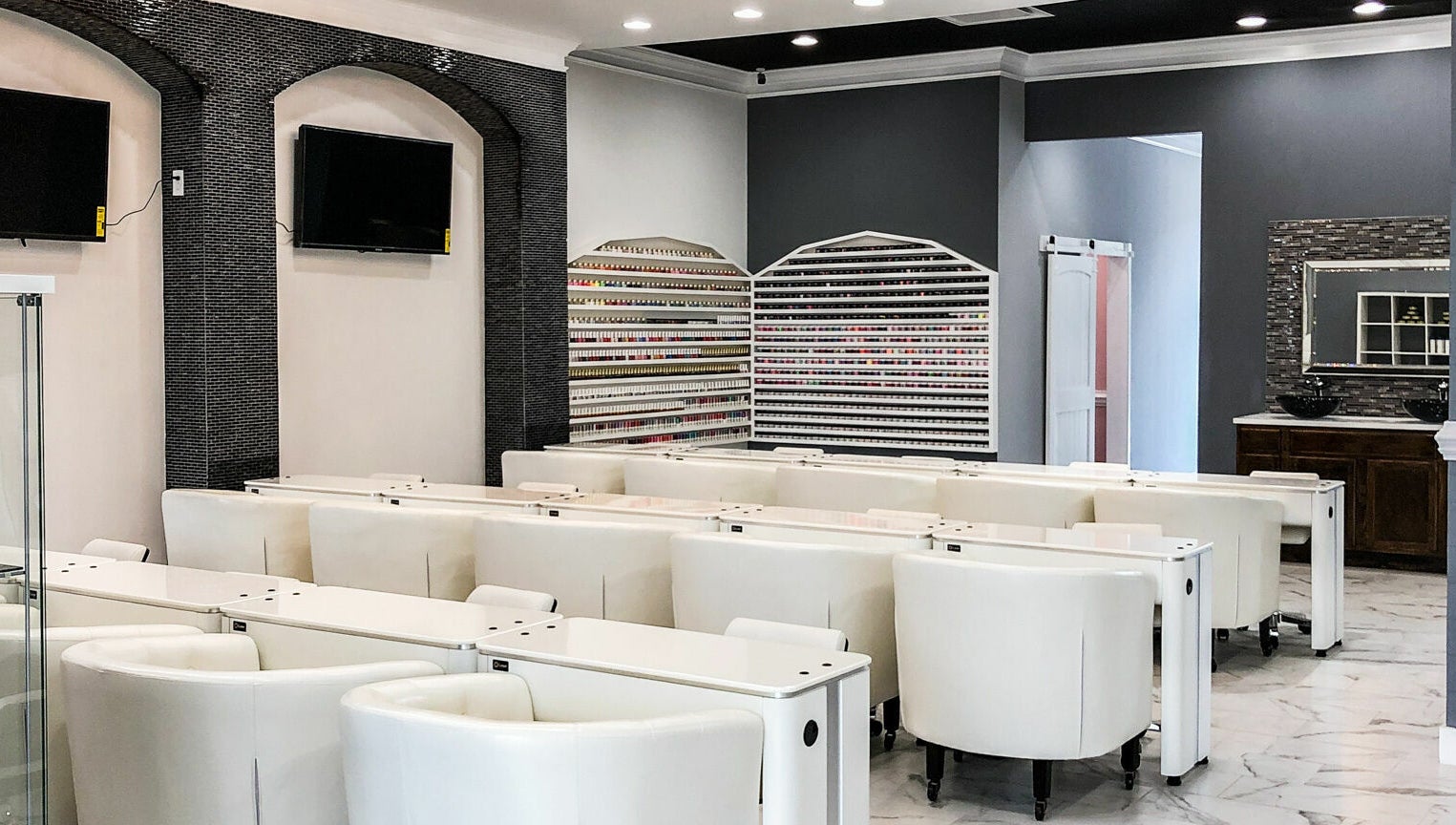 Inside Gloss Nail Bar showcasing modern nail stations in Clover, South Carolina, US.