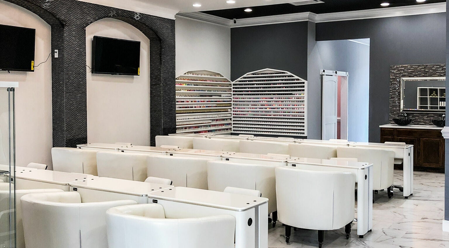 Inside Gloss Nail Bar showcasing modern nail stations in Clover, South Carolina, US.