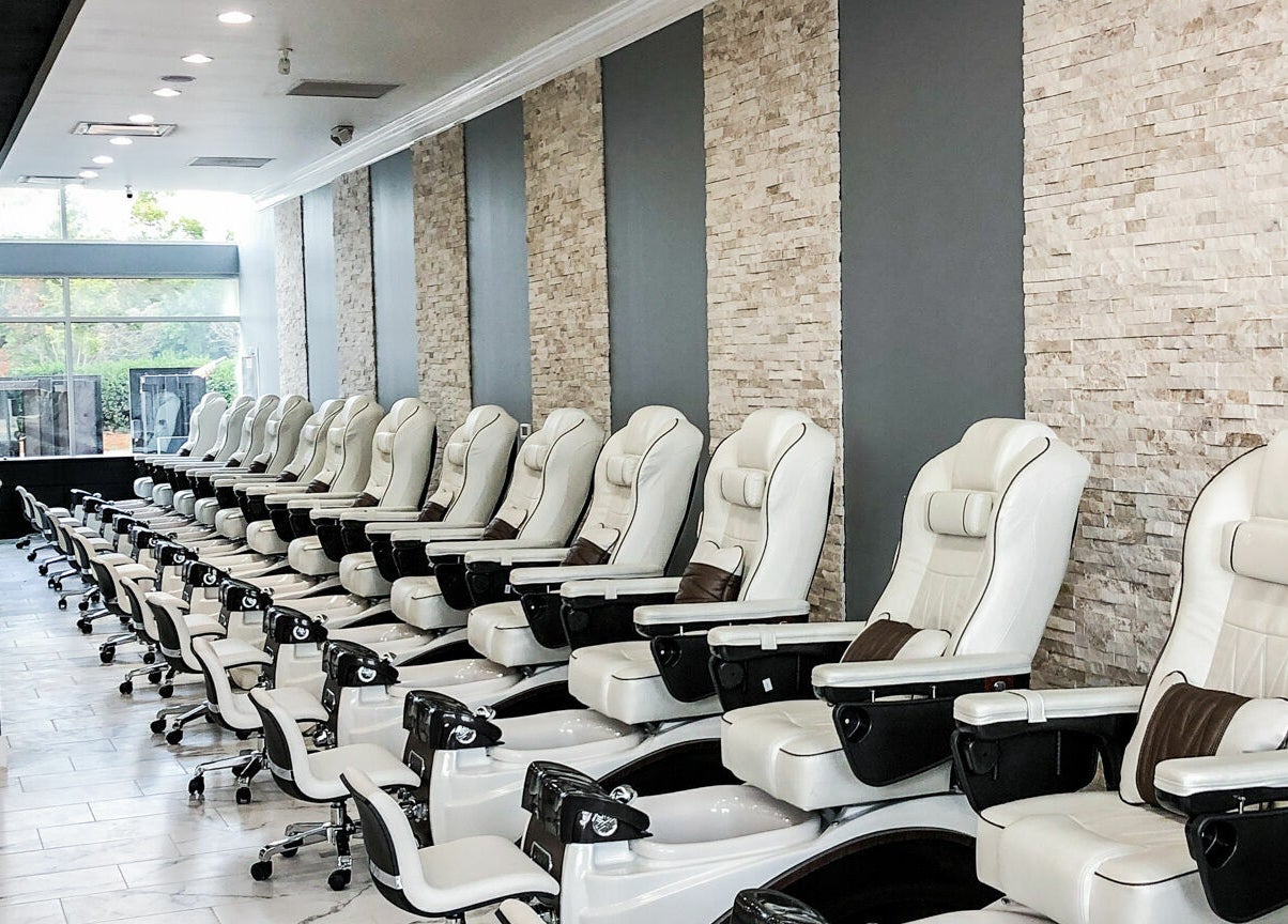 Elegant pedicure chairs at Gloss Nail Bar in Clover, South Carolina, US offering a tranquil experience.