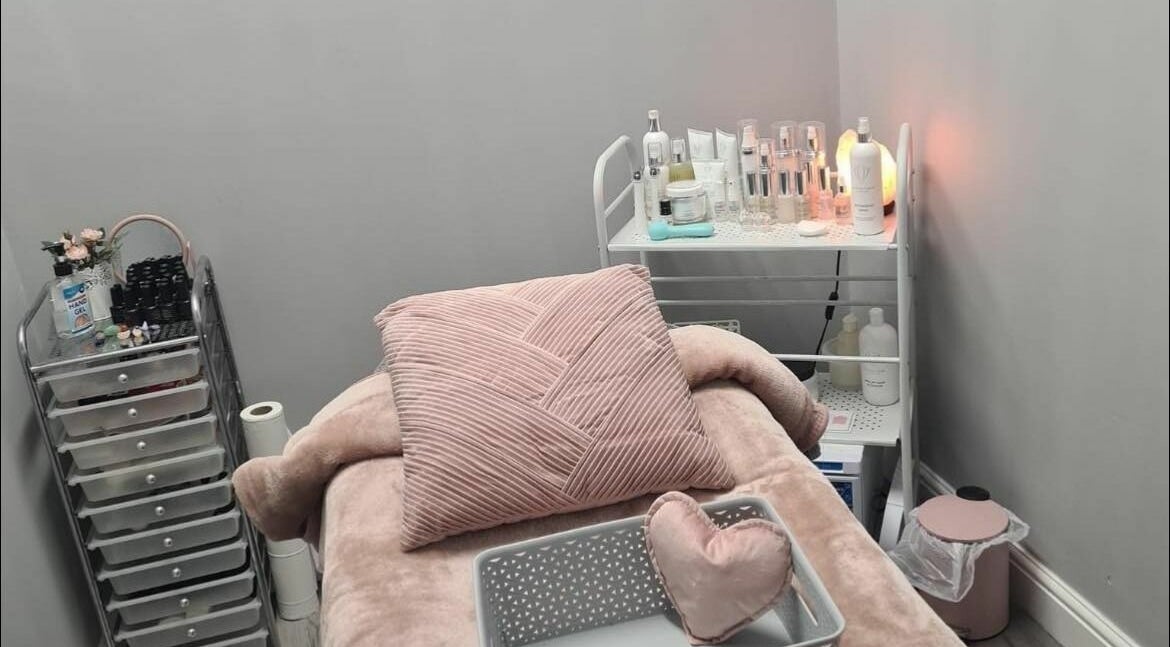 Relaxing treatment room at Ashley Allan Hair Replacement Studio, Sauchie, Scotland, GB, with plush decor.